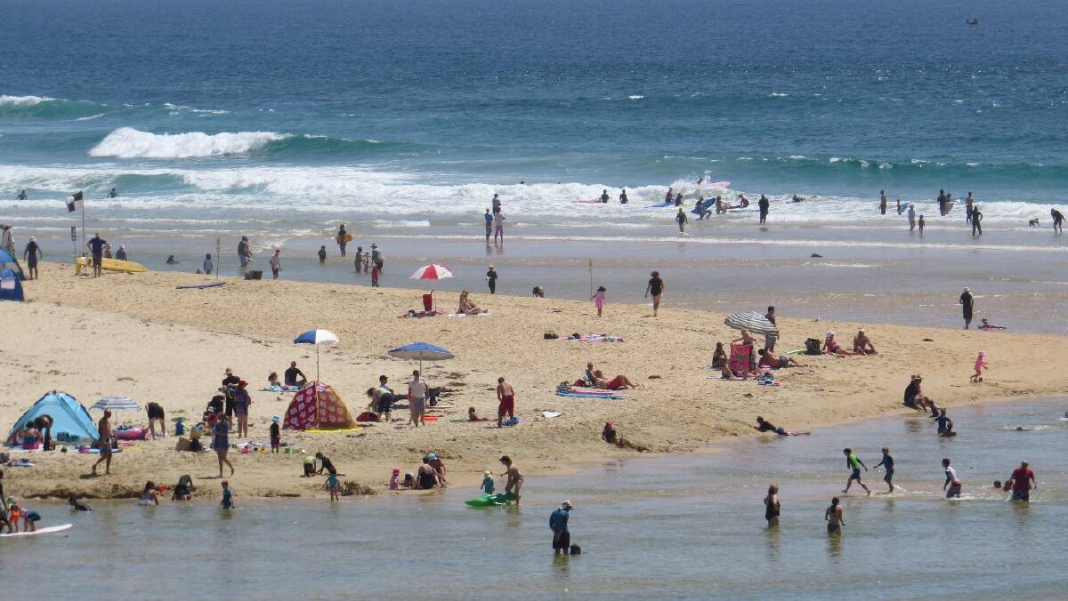 Photos of busy beaches in the Narooma area
