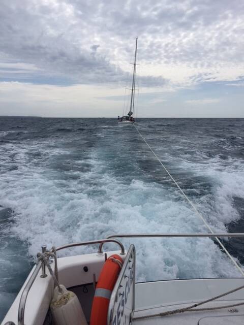 YACHT RESCUE: Recently, the Bermagui Marine Rescue BG30 crew towed in a 19 metre brand new and expensive yacht, which had lost steering in fairly heavy weather. 
