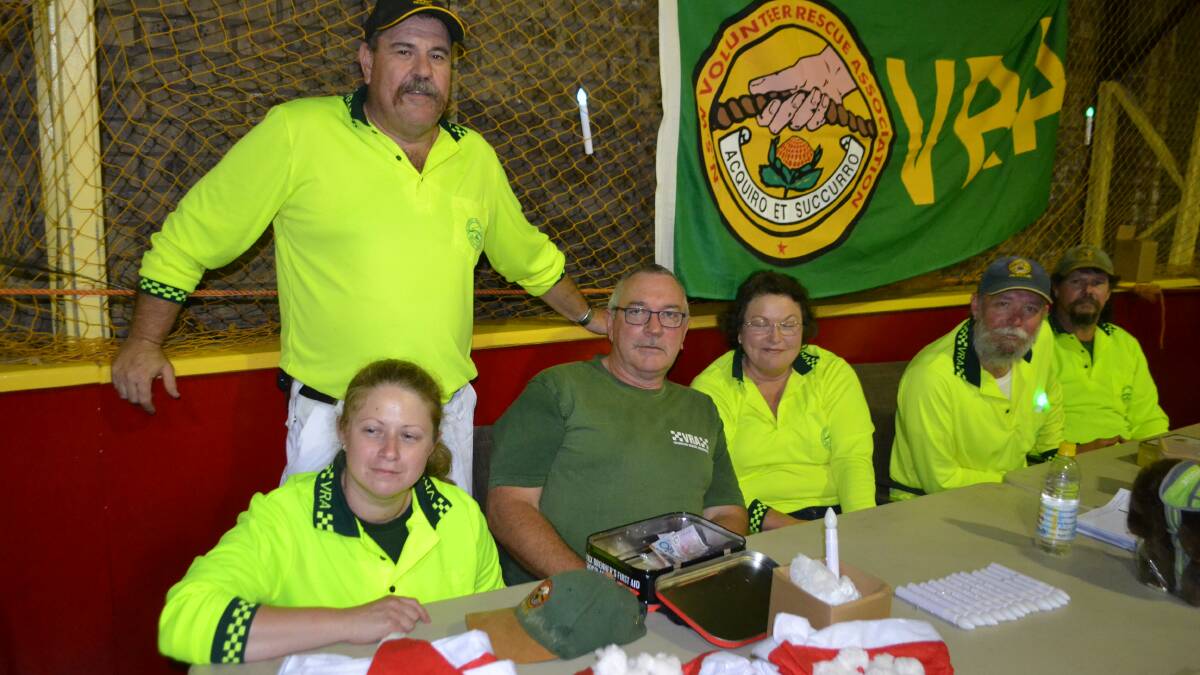 VRA CREW: Selling Christmas candles and hats are the crew from the Narooma VRA rescue squad Mal Barry, Jacqui Smith, Stuart Kennedy, Cheryl Edward, Dave Alabaster and Jeff Garrad. 