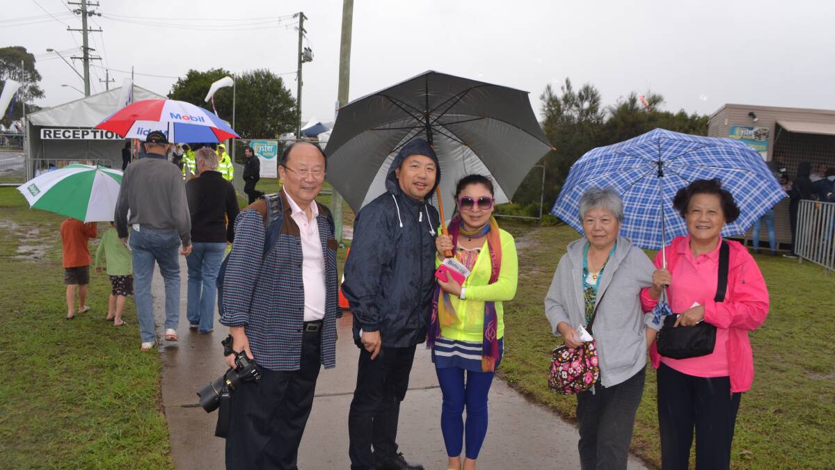 CHINESE VISITORS: David, Charlotte, Fang, Daing and Jing Qi from Sydney read about the Narooma Oyster Festival in their local Chinese language newspaper. Photo Stan Gorton