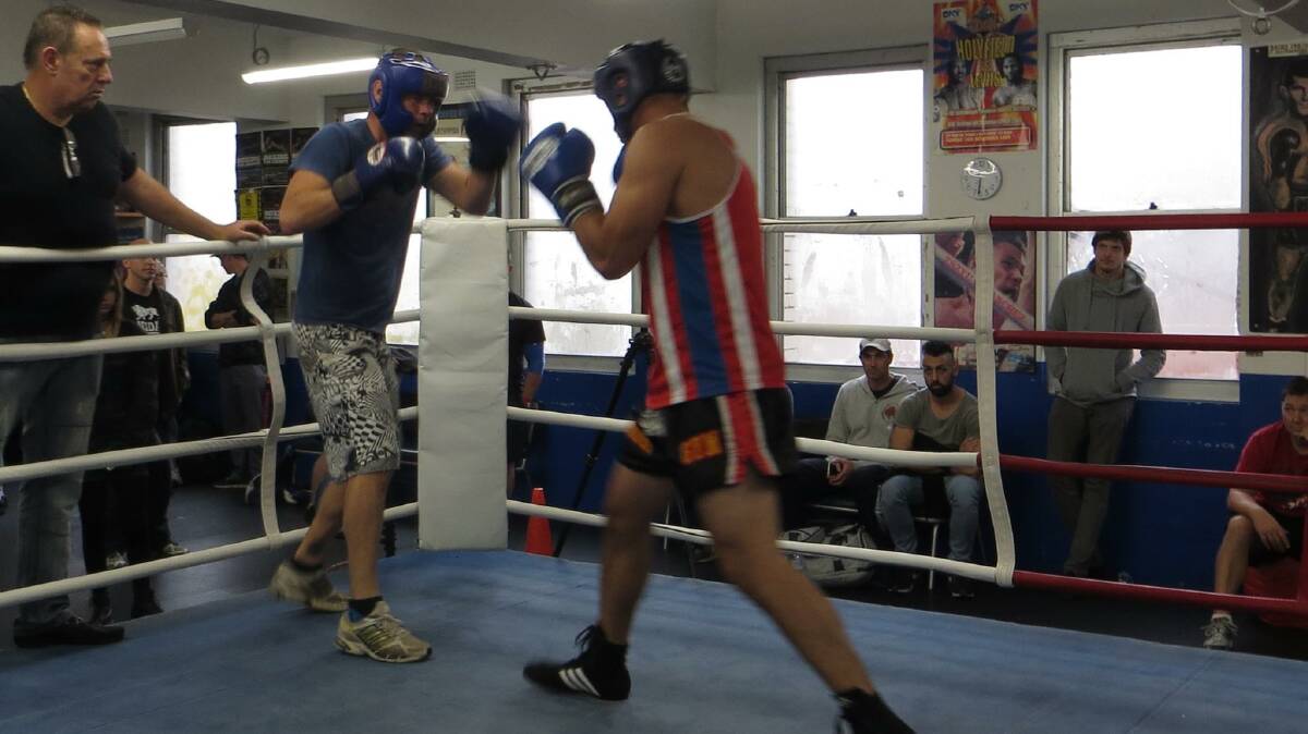 POLICE BOXER: Narooma police officer Scott Wharfe (left) qualifies for the fight night at an earlier assessment day.
 
