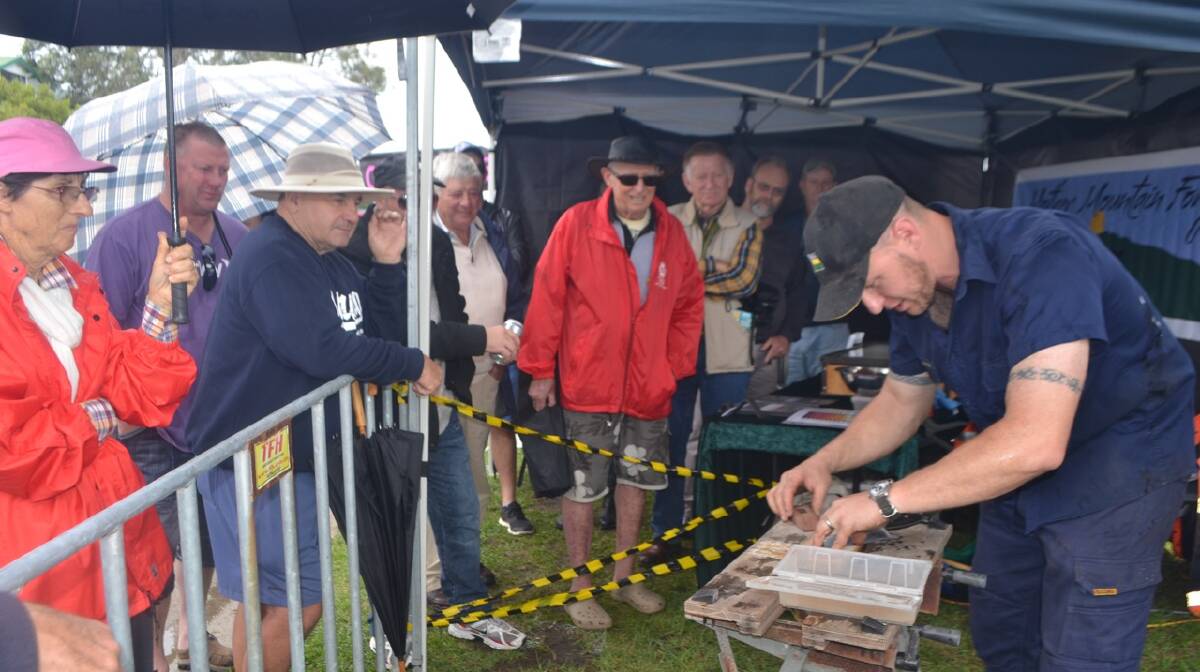 LOCAL BLACKSMITH: Local blacksmith Iain Hamilton from Mother Mountain Forge was a popular attraction at the Narooma Oyster Festival. Photo Stan Gorton