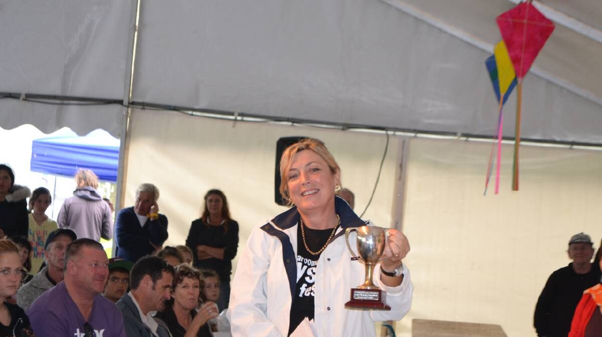THE TROPHY: Key organiser at the Narooma Oyster Festival Cath Peachy with the coveted NSW Farmers oyster shucking trophy. Photo Stan Gorton