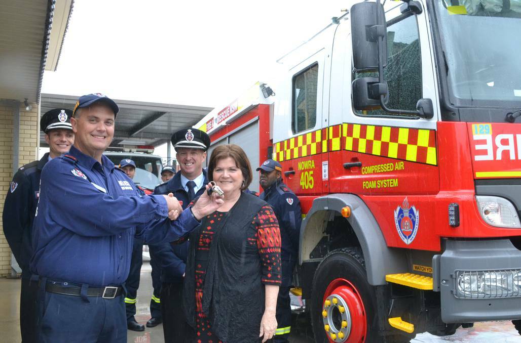 HAND OVER: South Coast MP Shelley Hancock presents the keys to the new $465,000 Compressed Air Foam System (CAFS) firefighting tanker to Nowra captain John Dun with Duty Commander Monaro Inspector Luke Unsworth and Batemans Bay Zone Commander Superintendent David Lewis.
 