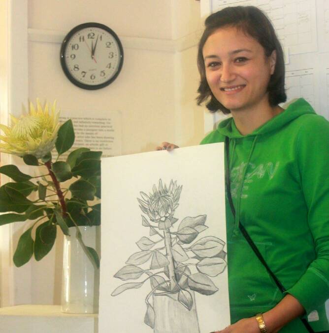 ALL THE WAY FROM LA: Rachel Murphy, a regular visitor to Narooma from Los Angeles, USA enjoys taking part in MACS drawing class as they prepare for MACS “Works on Paper” Exhibition at the SoART Gallery from April 16-22. 