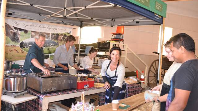 SIMPLY SYMPHONY: The good folk of Symphony Farm at Tilba serve up dishes of their organic beef at the Tilba Festival on Easter Saturday. Working the stand were Graham and Amanda Thompson and kids Brohdan, Huon and Heath.