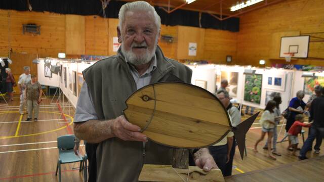 
BEST RECYCLED: Winner of the Best Recycled work at the Montague Arts and Crafts Society Easter Exhibition was Bill Shaw of Wallaga Lake with his “Snapper” creation made out steel from of a caravan gas bottle and Cyprus wooden flooring.
