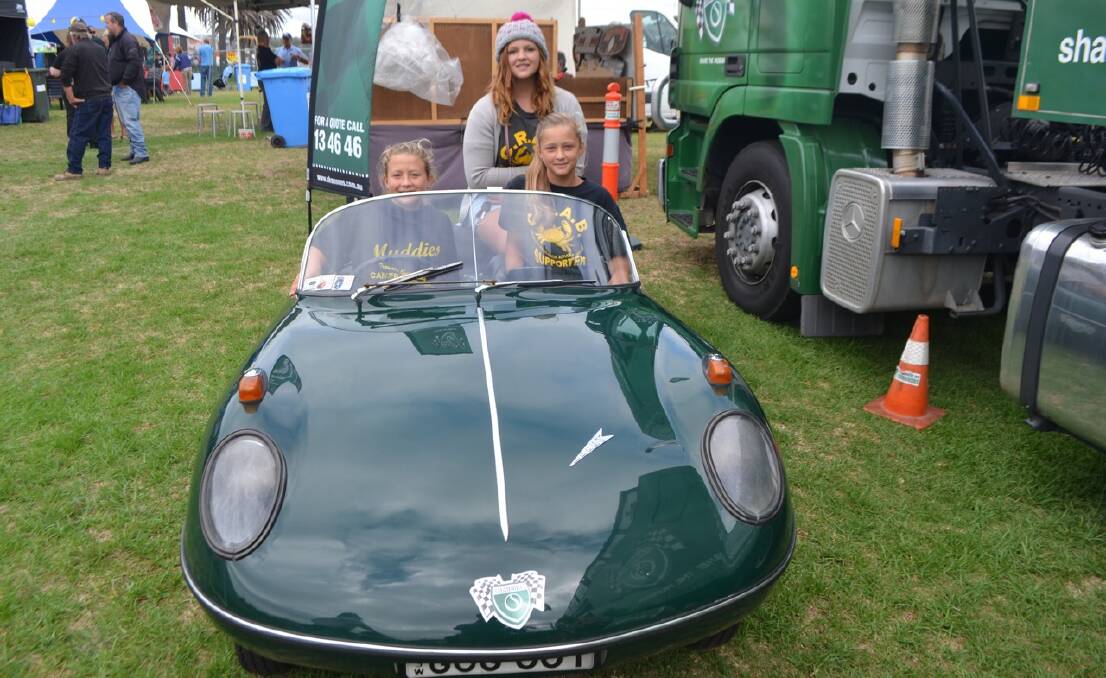 GOGO MOBILE: Emily and Grace Gowing and Mikayla Shaw sitting in the Shannons 1959 GogoMobil Dart powered by a 397cc 2-stroke. 