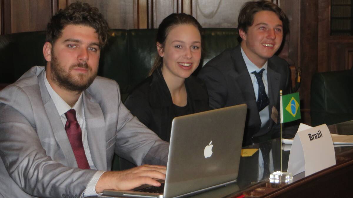MODEL UN: Narooma High students Chris Read, left, Mollie Wharfe and Jesse Hawke representing Brazil at the Model United Nation Assembly in Canberra’s Old Parliament House recently. Photo courtesy MUNA 