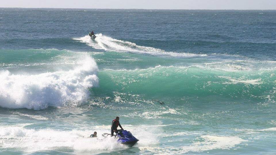 TOW-IN SURFING: Lin Wilton snapped some great shots of Narooma locals Tony and Bradley Lawson tow-in surfing the Narooma bar on Sunday. 