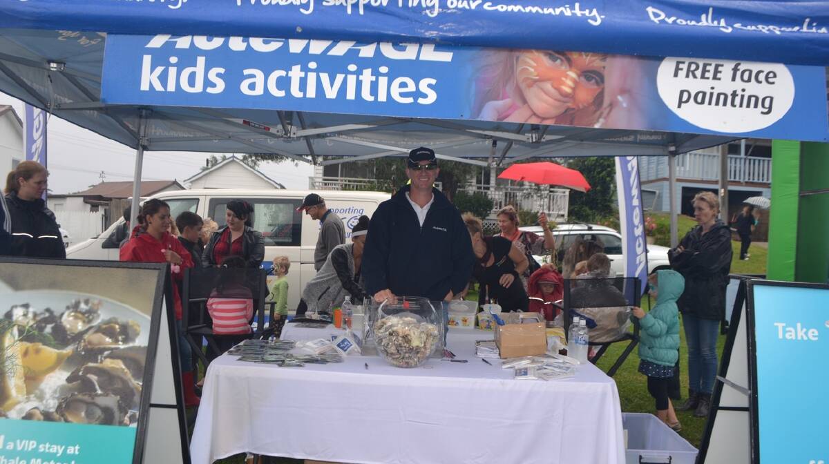 ENERGY STALL: At the ActewAGL stall at the Narooma Oyster Festival. Photo Stan Gorton