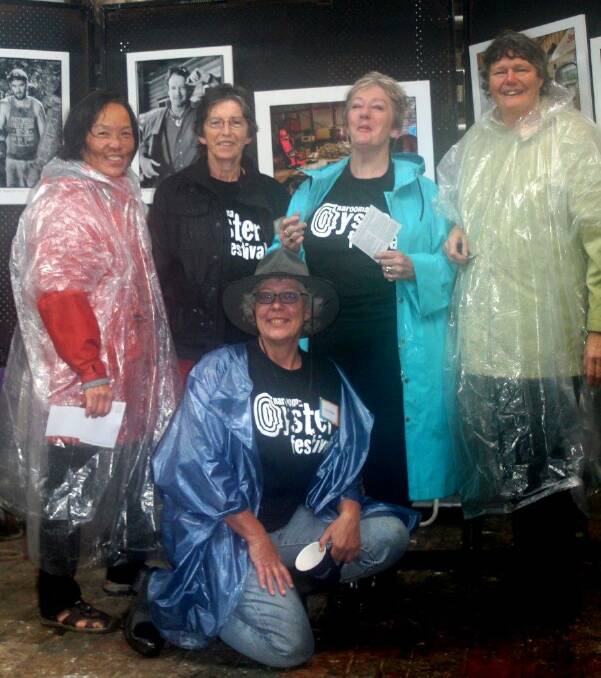 VOLUNTEERS: Volunteers for the NSW Country Arts Support Program enjoyed a break from their kite project and dried off inside the Heide Smith Photographic exhibition....from left;  Oung Niennattrakul, Vivienne Bowe Wood,  Judy Glover, Dorothy Noble, and in front, Chris Perrott. Photo by Rosy Williams 