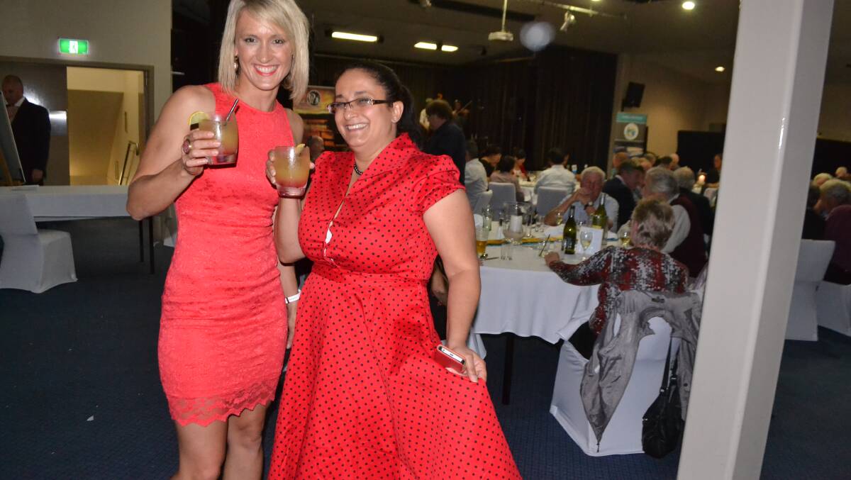 GIRLS IN RED: Looking fantastic in red are Narooma chamber president Orit Karny Winters with Louisa Bonner from Bingie at the Narooma Oyster Festival dinner at the Narooma Golf Club on Saturday night. Photo Stan Gorton 
