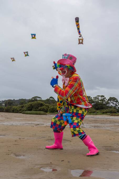 COLOURFUL CLOWN: Patrick the clown was a colourful fixture on a grey day at the 2014 Narooma Oyster Festival, Photo Toby Whitelaw
