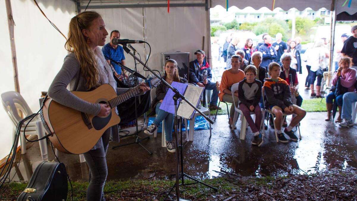 LOCAL MUSICIAN: Local musicians including Sam Sly performed at this year's Narooma Oyster Festival. Photo by Toby Whitelaw