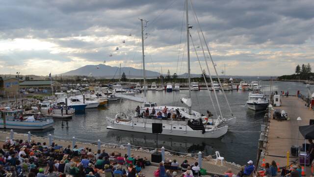 HARBOUR PERFORMANCE: Melanie Horsnell of Candelo and her band perform on the MV Pelican at the free Four Winds community concert at the Bermagui Fisherman's Wharf.