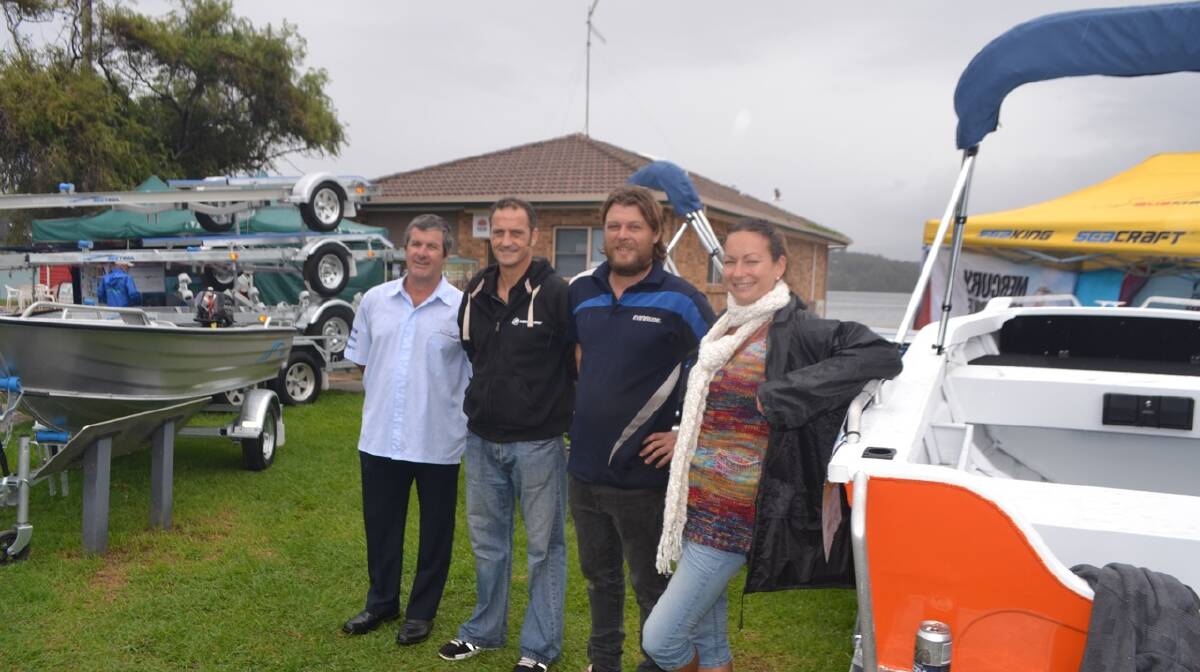 BOAT STAND: At the Kingfisher Marine and Automotive stand at the Narooma Oyster Festival are Sean Carroll, Nick Jean-Mairet, Colin Leechman and Hannah Jean-Mairet. Photo Stan Gorton