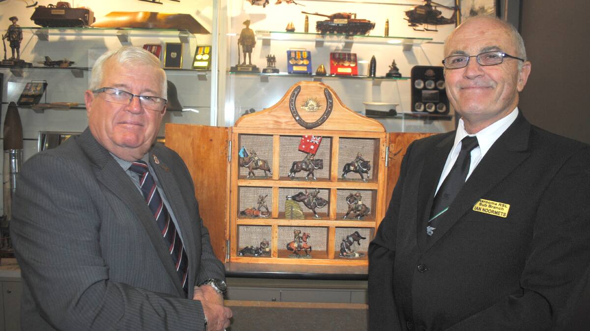 LIGHT HORSE DIORAMA: Narooma RSL sub-branch president, Paul Naylor and RLS welfare officer Ian Noormets with some of the Light Horse figurines that have already been purchased for the special diorama of the Charge of Beersheba that will be exhibited in the foyer of Club Narooma. 