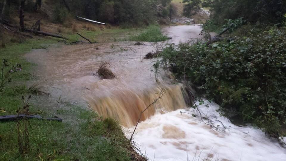 RAIN EVENT: Narooma resident Dave Moran posted some photos of the creek at his Tilba property on his Facebook entitled the "rain event of 2014".