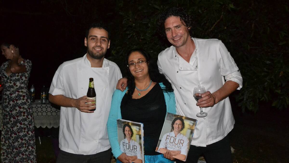 BOOK SIGNING: Narooma chamber president Orit Karny Winters gets books signed by Four in Hand head chef Paul Farag and chef and restaurateur Colin Fassnidge.