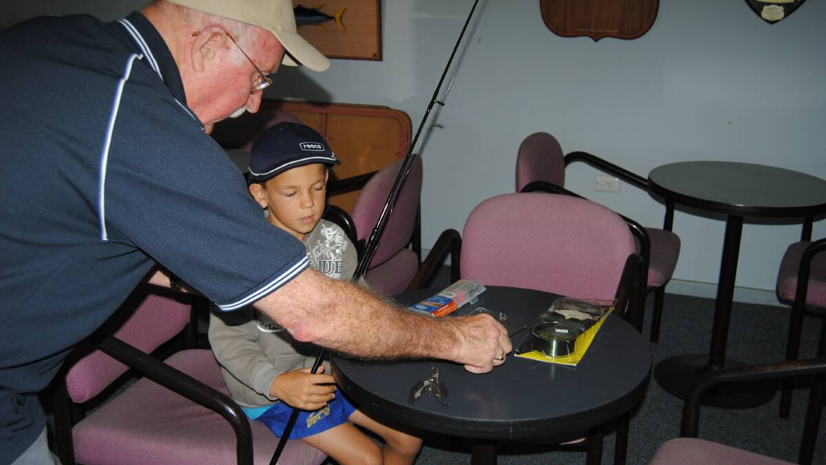 PERSONAL TUITION: Club member Barry Wells works with one of the kids. 