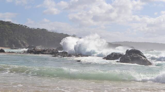 SUNDAY SWELL: Massive seas pound Mystery Bay on Sunday morning as the current East Coast Low sulks off Narooma Bermagui. Photo Stan Gorton