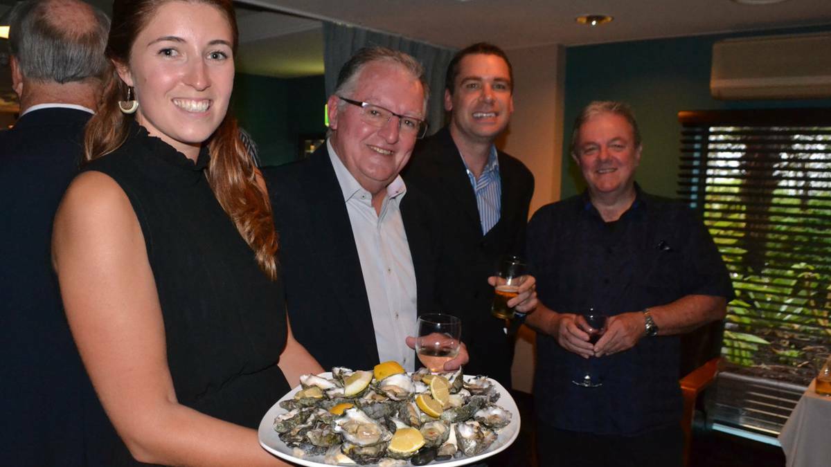 OYSTERS ANYONE: Elyce Finney offers up oysters to festival treasurer Paul Dixon, David Palywoda from ActewAGL and deputy mayor Neil Burnside. 
Photo Stan Gorton
 