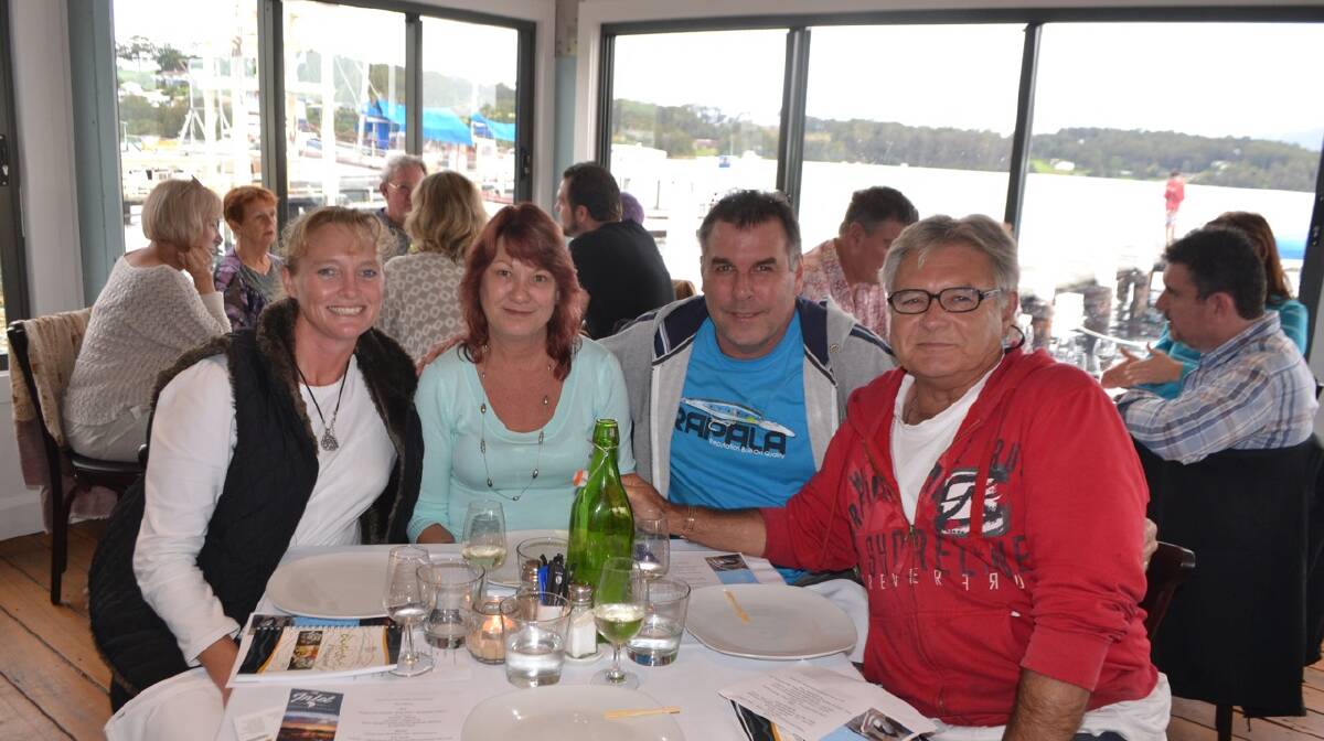 OYSTER LOVERS: Part-time Narooma residents Katie Staines, Melissa and Michael Johnson all of Canberra with friend and local Chris Webb at the Ultimate Oyster Experience at the Narooma Oyster Festival. Photo Stan Gorton