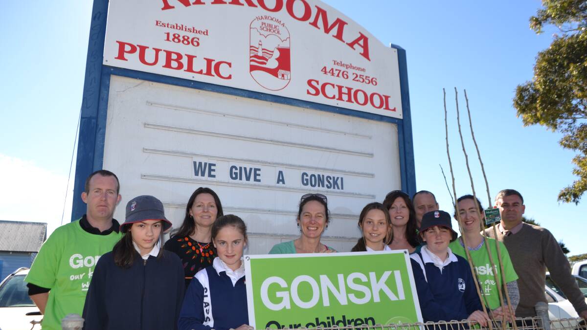 GONSKI PLANTING: Planting the mulberry tree at Narooma Public School on Monday are students Shannon, Emma, Lilly and Clair with teacher Mr Henry George, P&C members Kristy Smith, Emma Carr, Jenny Owens-Roberts, teachers Mr Daniel Roberts, Ms Sarah Harding and principal Paul Sweeney. 