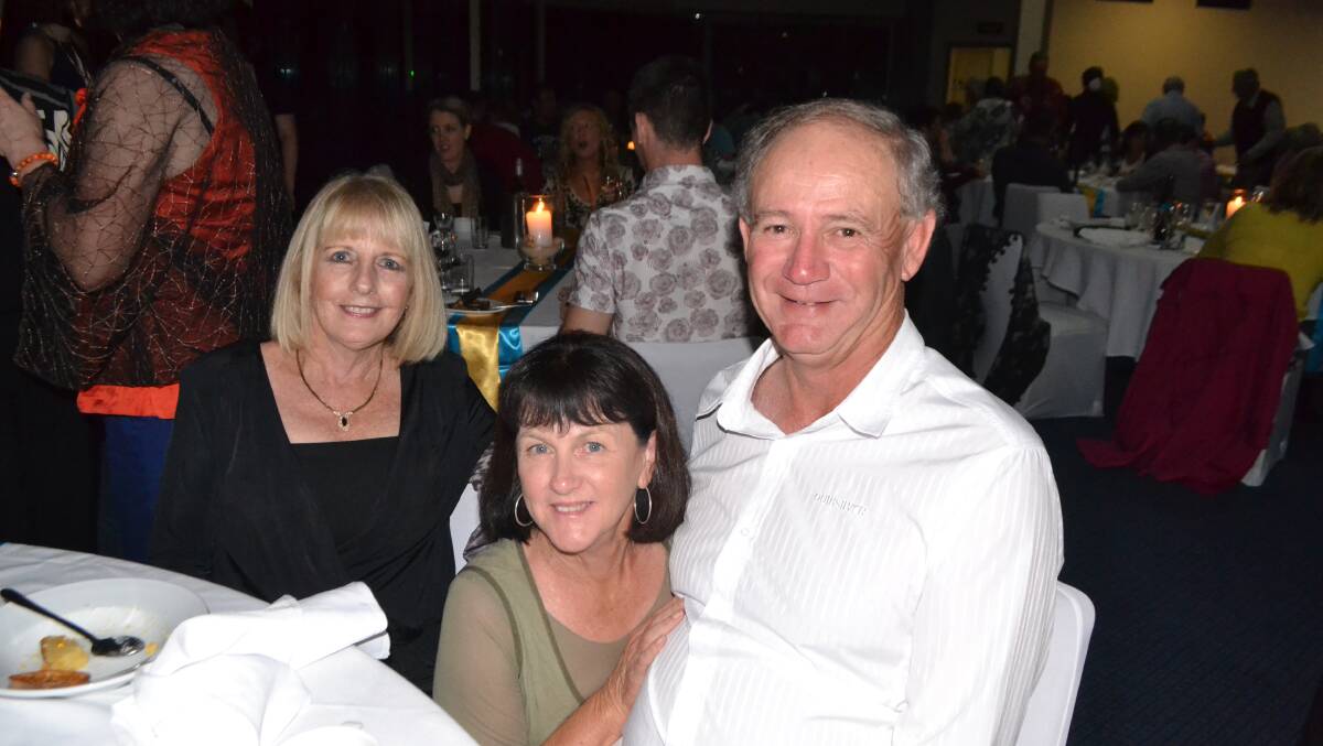NAROOMA CREW: Bill and Ann Durnan and Chris Hendra at the Narooma Oyster Festival dinner at the Narooma Golf Club on Saturday night. Photo Stan Gorton 