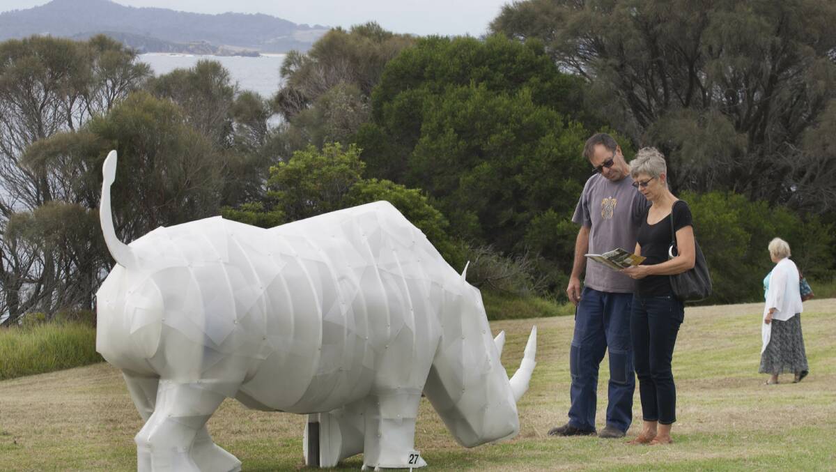 BIG RHINO: David and Jenny Stewart of Tathra view Ben Eyles’ "Don't Forget about Me" big rhino at Sculpture on the Edge at Bermagui. 