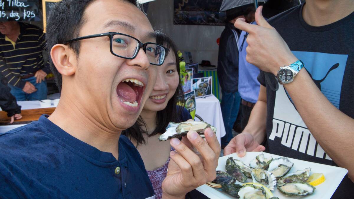GOURMET FAIR: Visitors enjoyed being able to compare the flavours of oysters from different South Coast estuaries at Narooma Oyster Festival’s Naturally Gourmet Fair on Saturday. Photo by Toby Whitelaw