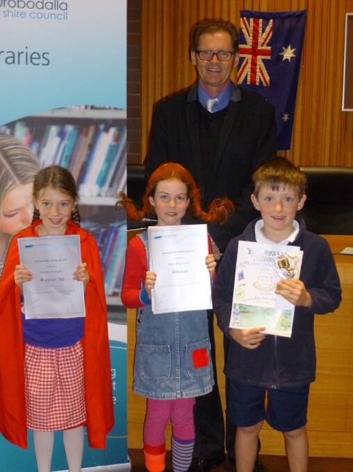 NAROOMA AUTHORS: Stephie Ovington (Little Red-Riding Hood), Ruby Efraemson (Pippi Longstocking) and Jacob Bartusch-Rice with mayor Lindsay Brown at the 2014 Mayor’s Writing Competition awards ceremony. 