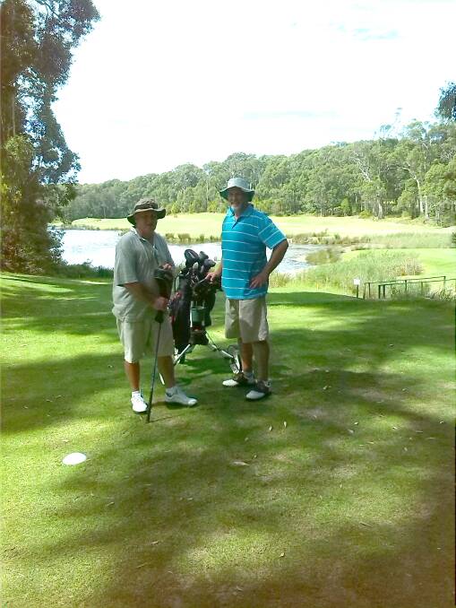 PLAYING A ROUND: John Rimmer and Led Campbell on the 15th green at Narooma Golf Course. 