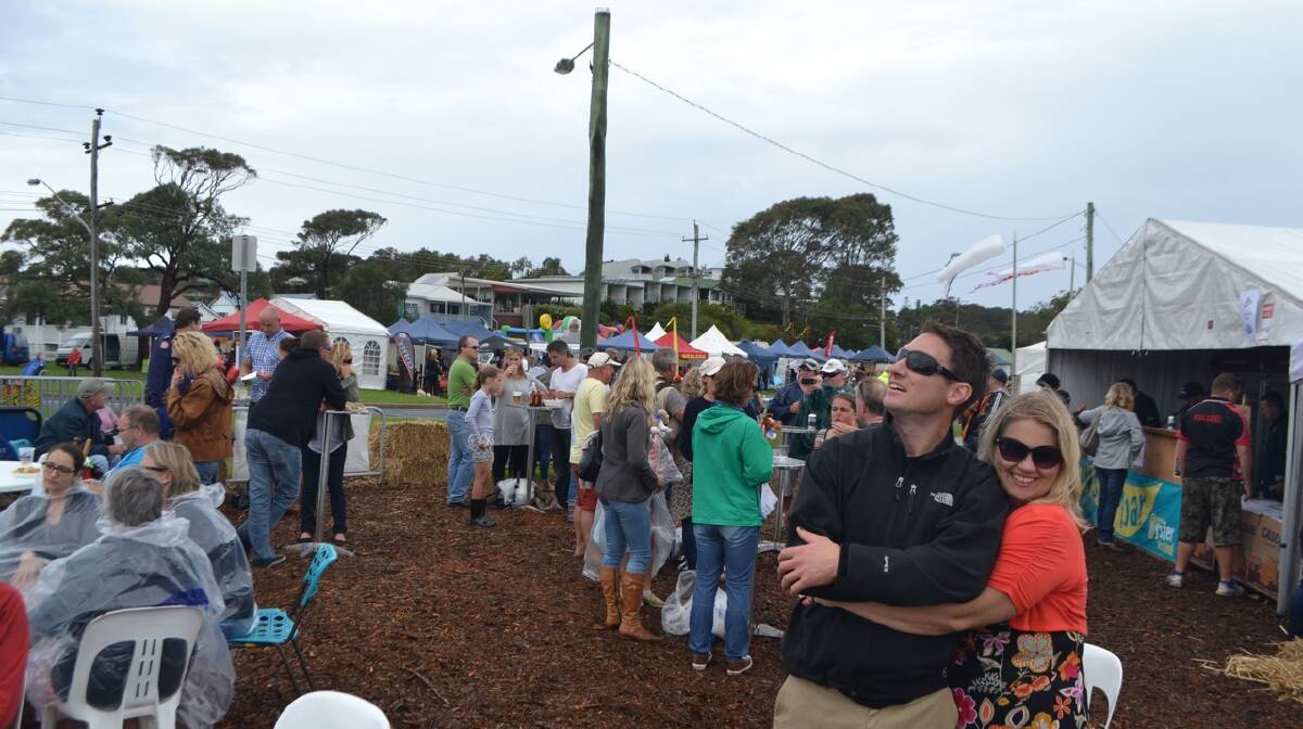 KITE LOVERS: Ben and Rachel Wulff from Campbelltown enjoy the kites at the Narooma Oyster Festival. Photo Stan Gorton