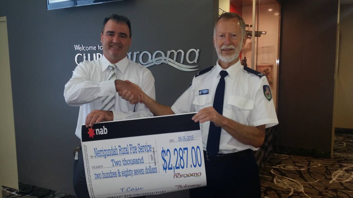 CLUB GRANT: Narooma Sporting and Services Club general manager Tony Casu presenting a cheque to Laurie Edebohls, secretary Nerrigundah Rural Fire Service brigade. The Narooma Sporting and Services Club helping the district keep fire safe and helping to keep lives and the environment safe. 