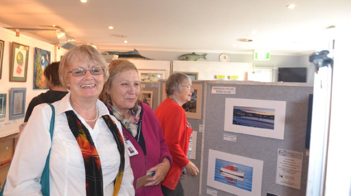 PHOTO SHOW: Heather May and Rosy Williams at the Narooma Oyster Festival photography show. Photo Stan Gorton