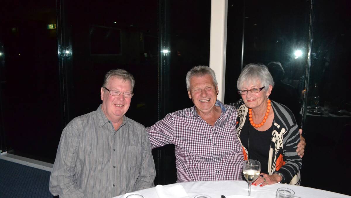HAPPY LOCALS: Kevin Cullen, Pam Grant and Geoff Lanham at the Narooma Oyster Festival dinner at the Narooma Golf Club on Saturday night. Photo Stan Gorton 