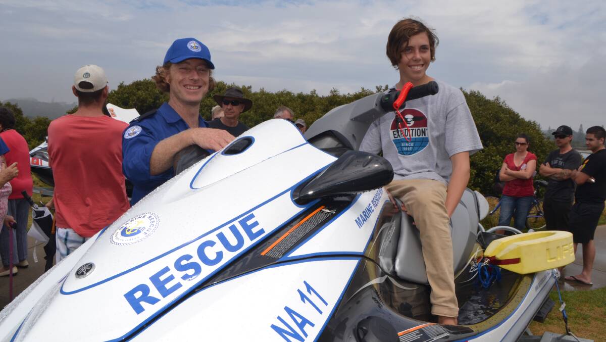 JETSKI DRIVER: One of the qualified Jet-ski drivers for Marine Rescue Narooma is Ben Woolnough pictured showing the personal water craft to Monty O’Brien. 