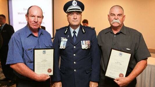 POLICE COMMENDATION: Rod Howard (right) and his business partner Mark McNicol receive a police commendation for their actions from the NSW Police Assistant Commissioner. They will now receive a Bravery Medal from the Governor General. 