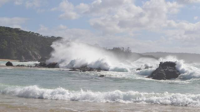 SUNDAY SWELL: Massive seas pound Mystery Bay on Sunday morning as the current East Coast Low sulks off Narooma Bermagui. Photo Stan Gorton