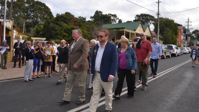 IN HONOUR: Among those marching in honour of relatives and leading the group are Tilba locals Arthur Worthly and Phill Stokes.