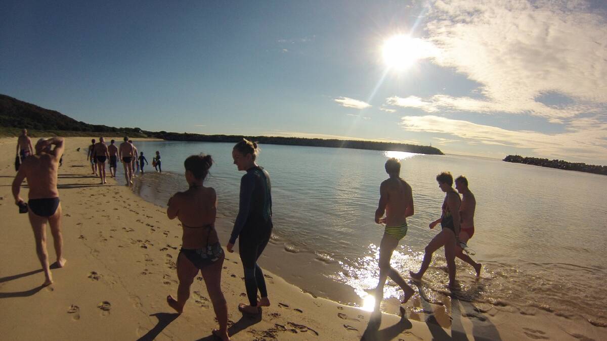GoPro photos of the Narooma Numnutz winter swimmers making it through the bar crossing