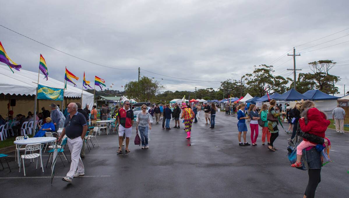 RAINY DAY: Crowds at the 2014 Narooma Oyster Festival were down but were still good. Photo Toby Whitelaw