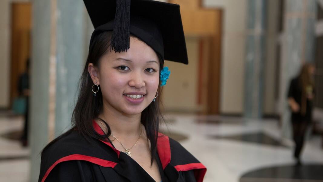 SMART COOKIE: 22-year-old Lucy Nguyen from Narooma graduated with a double degree in commerce and tourism management from the University on Thursday.   