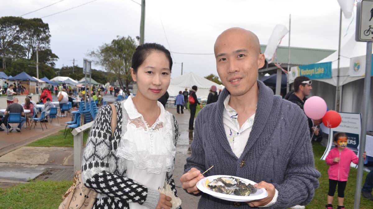 WEIBO FANS: Rachel Liu and Luke Lee from Sydney heard about the Narooma Oyster Festival on the Chinese micro-blogging website Sina Weibo thanks to some slick marketing this year. Photo Stan Gorton