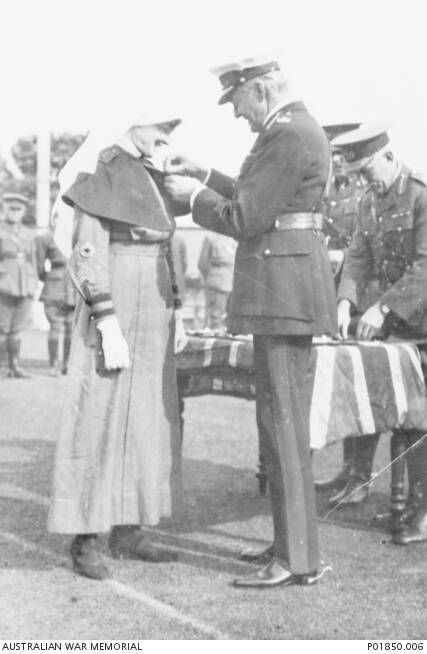 MILITARY MEDAL: Lord Forster, Governor General of Australia (right), presenting the Military Medal to Sister Pearl Corkhill Victoria Barracks, Sydney, on June 5, 1924.  