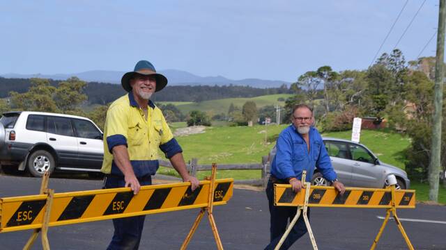 LOCAL WORKERS: Assisting in traffic duties to close off Bate Street are council worker and Tilba local Dave Preston and Phil Elton from Tilba Leather.