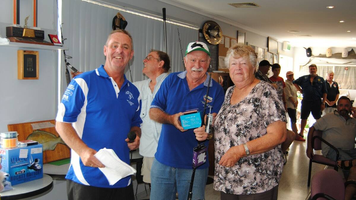 PRIZE WINNER: NSGFC president Mick Roberts and official Barry Wells with Faye Hanson from Nowra, getting the award for the senior catch and release. 