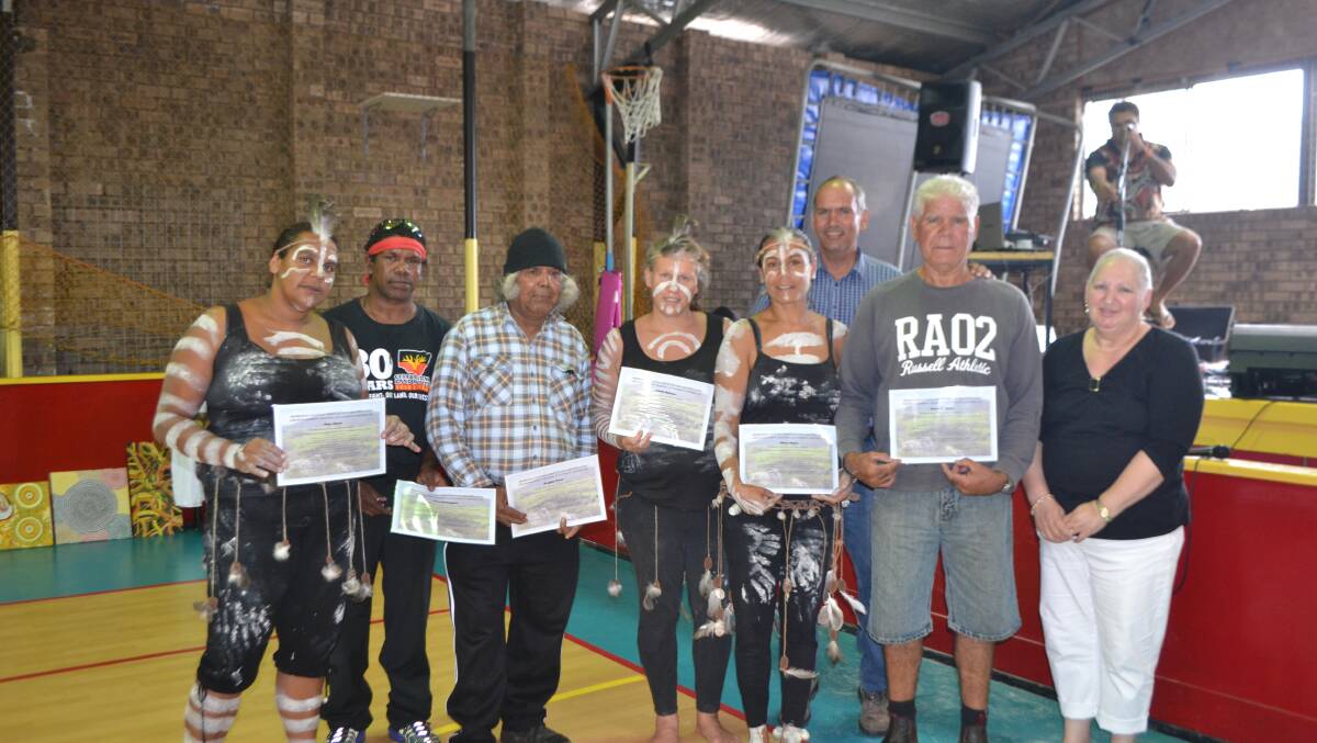SITE OFFICERS: Receiving their Site Officer certificates are Mary Moore, Keene Ballangarry, Douglas Mason, Natalie Bateman, Sharon Mason and Ron Mason with site archaeologist teacher Steve Free and Gulaga Board chairwoman Iris White. 